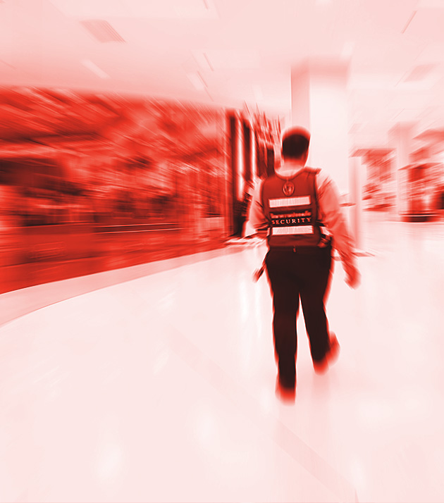 Male security guard patrolling in mall